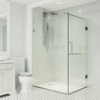 Modern shower enclosure with reversible hinged door and towel bar in brushed nickel finish