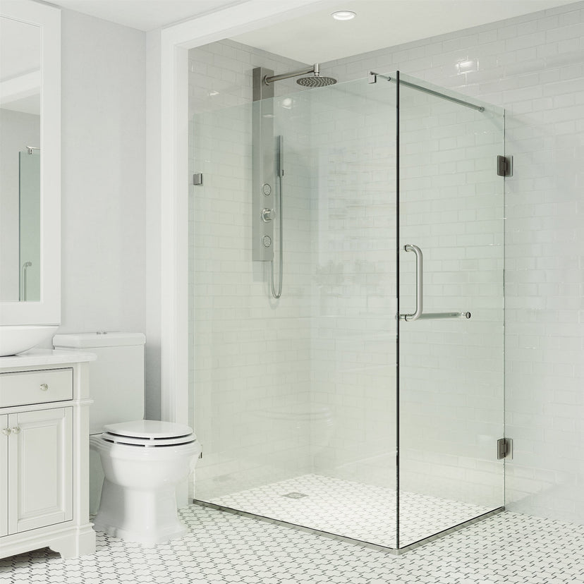 Modern shower enclosure with reversible hinged door and towel bar in brushed nickel finish