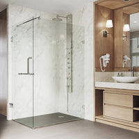 Clear glass shower enclosure with stainless steel hardware and brushed nickel frame