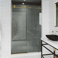 Clear glass frameless shower door with matte gold bar handle, 44-48 in. width