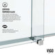Modern frameless shower door with chrome finish, reversible installation, clear tempered glass