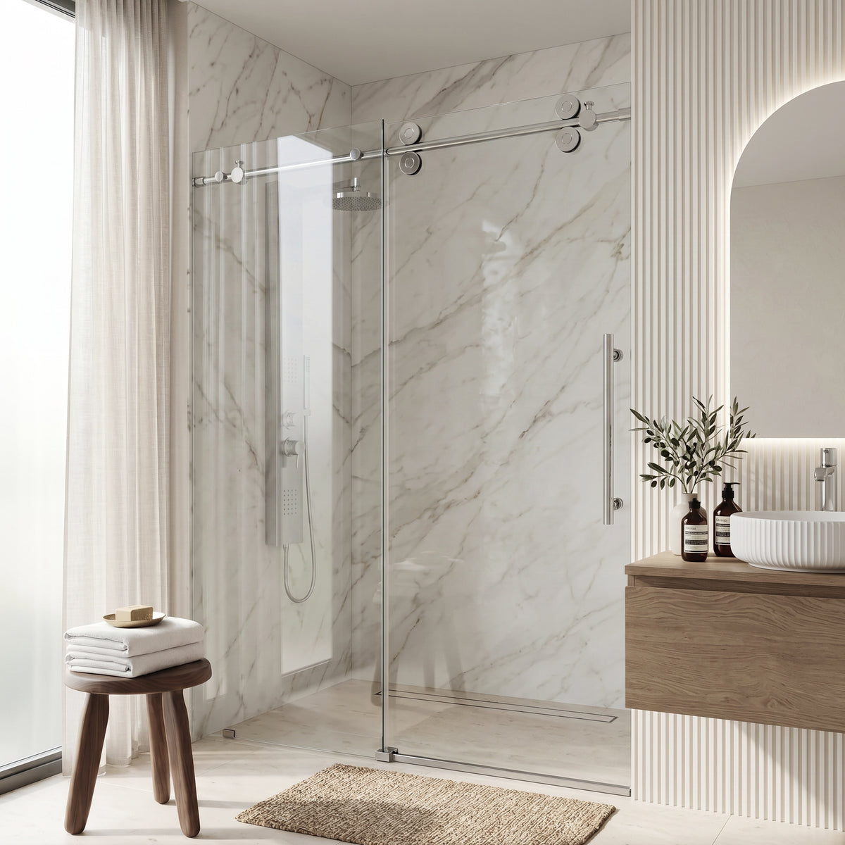 Modern bathroom with glass shower enclosure, wooden vanity, and marble walls.