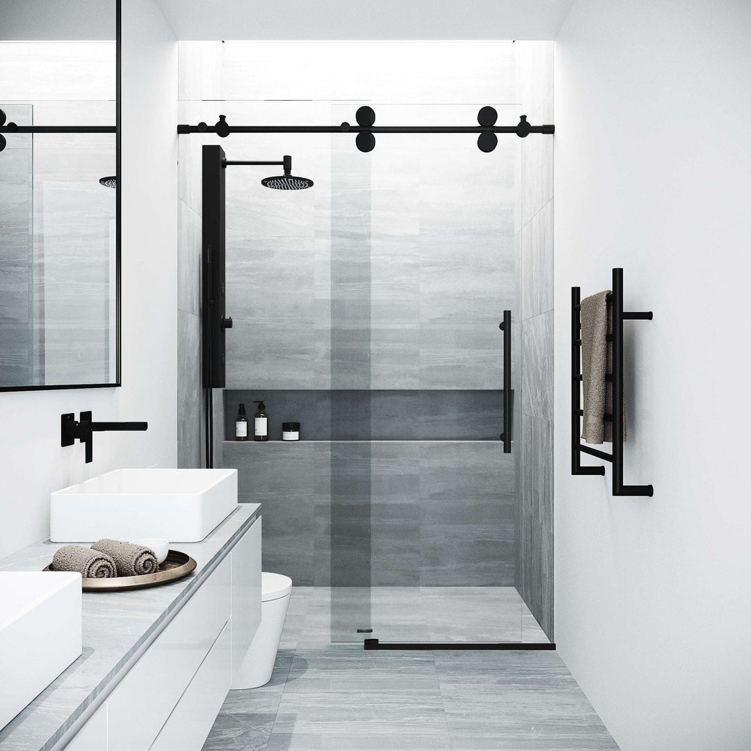 Modern frameless shower door with matte black hardware and cool touch exterior