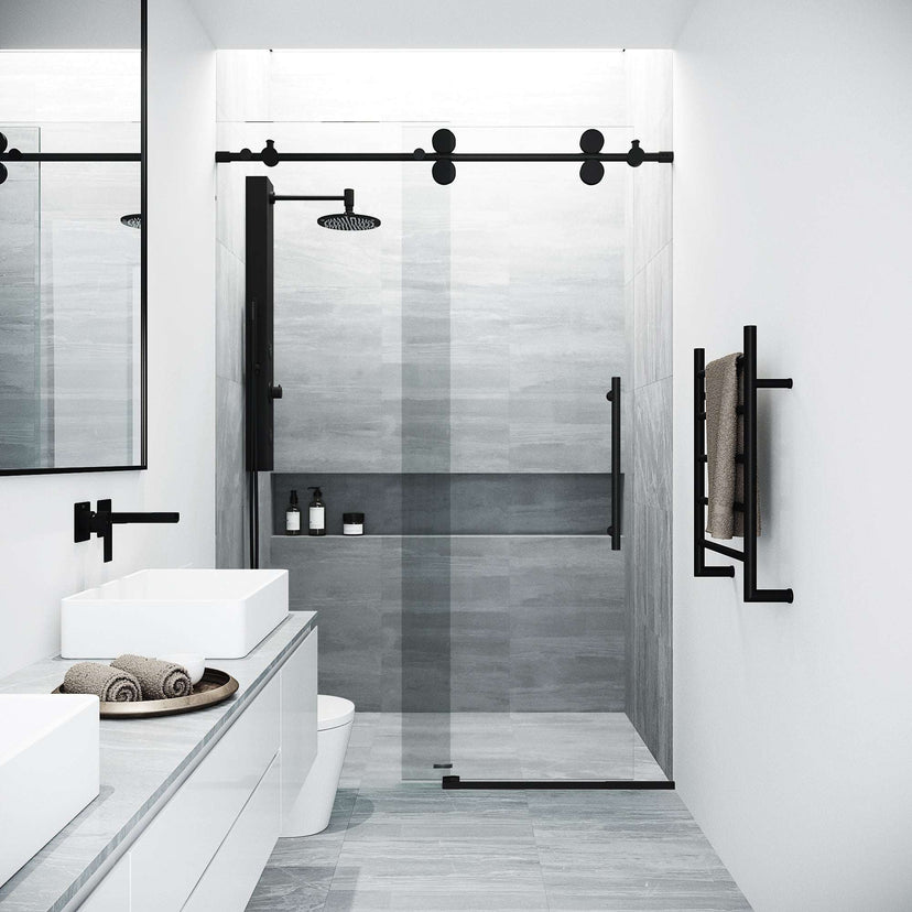 Modern frameless shower door with matte black hardware and cool touch exterior