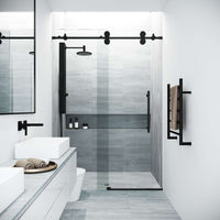Modern frameless shower door with matte black hardware and cool touch exterior