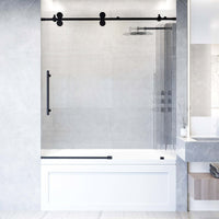 Matte black frameless sliding tub door with fluted tempered glass