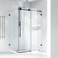 Clear glass shower enclosure with matte black finish and sliding door design