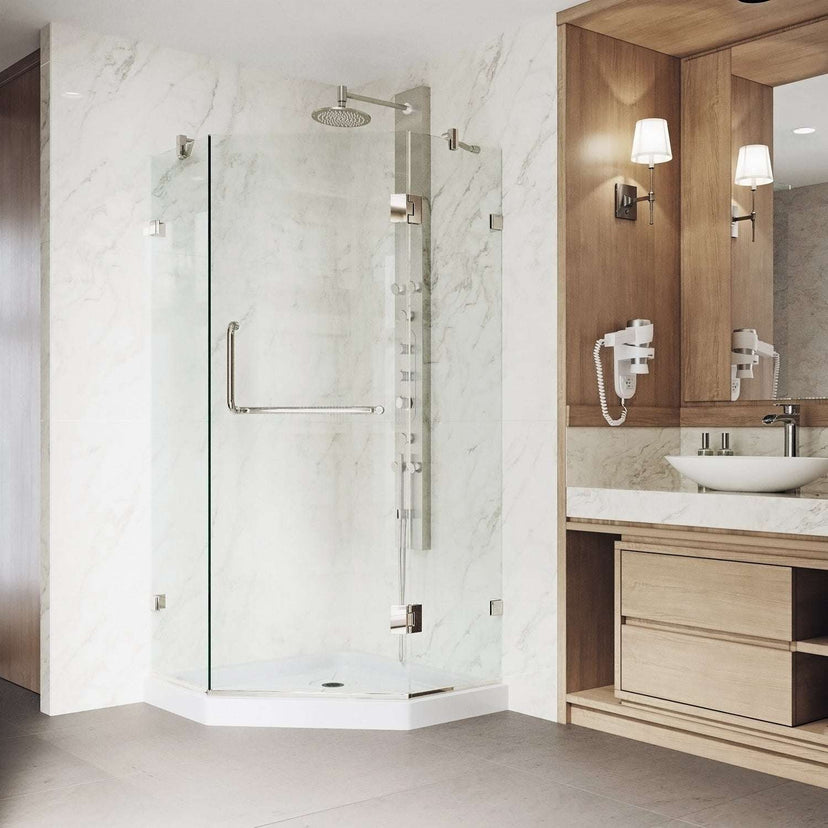 Clear glass shower enclosure with brushed nickel finish and reversible door