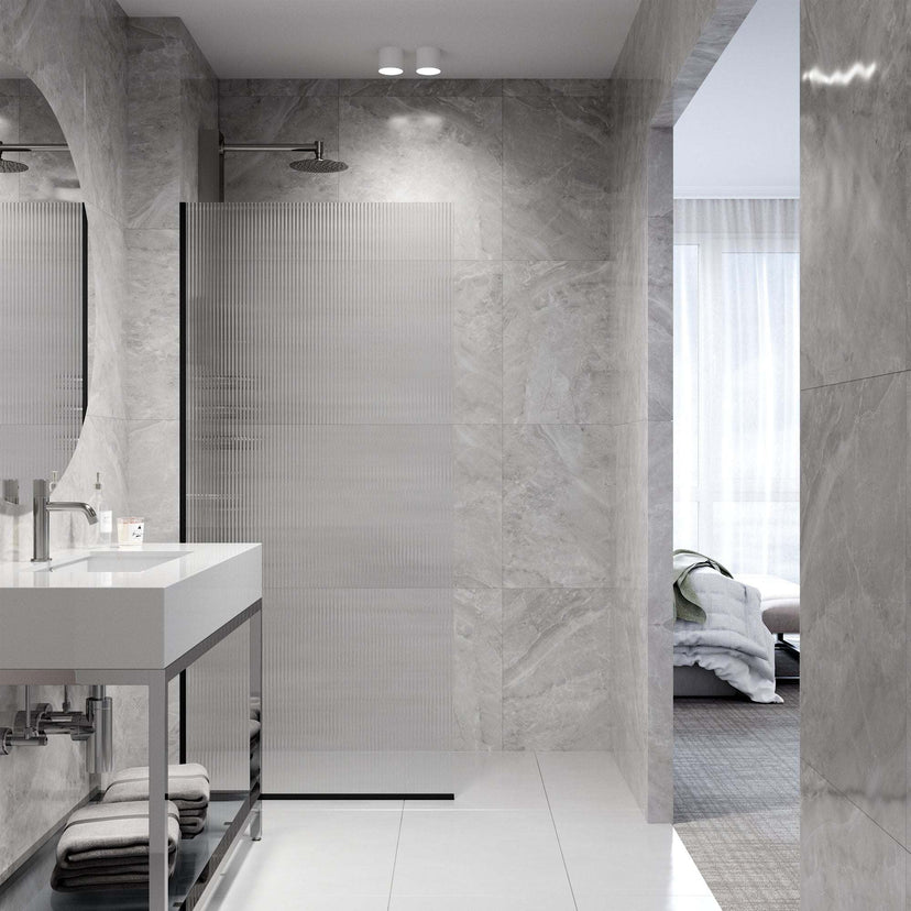 Contemporary frameless shower door in matte black with fluted glass and stainless steel components