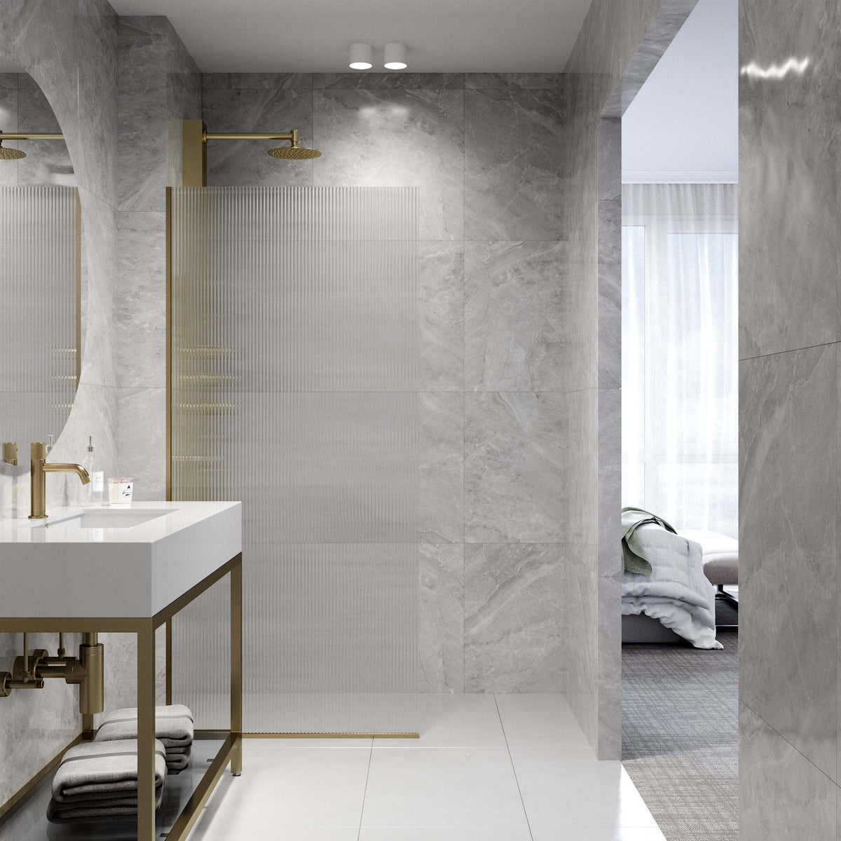 Contemporary frameless shower door in matte gold with fluted glass and stainless steel components