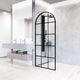 Fixed shower screen featuring clear grid glass and matte black frame