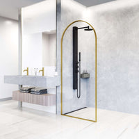Fixed shower screen with stainless steel hardware and matte gold frame