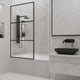 Contemporary bathtub screen featuring framed design, clear glass, and stainless steel components