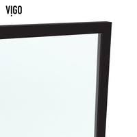 Framed shower screen with matte black grid design and mixed clear, privacy, and white glass panels inspired by Mondrian art