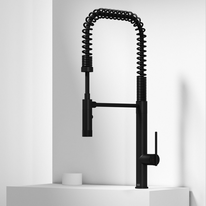 Designer pull-down kitchen faucets in matte black, stainless steel and gold finishes for modern kitchens